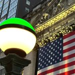 Financial Markets Wall Street FILE - The American flags hangs on the facade of the New York Stock Exchange in New York's Financial District on Tuesday, Nov. 5, 2024. (AP Photo/Peter Morgan, File)