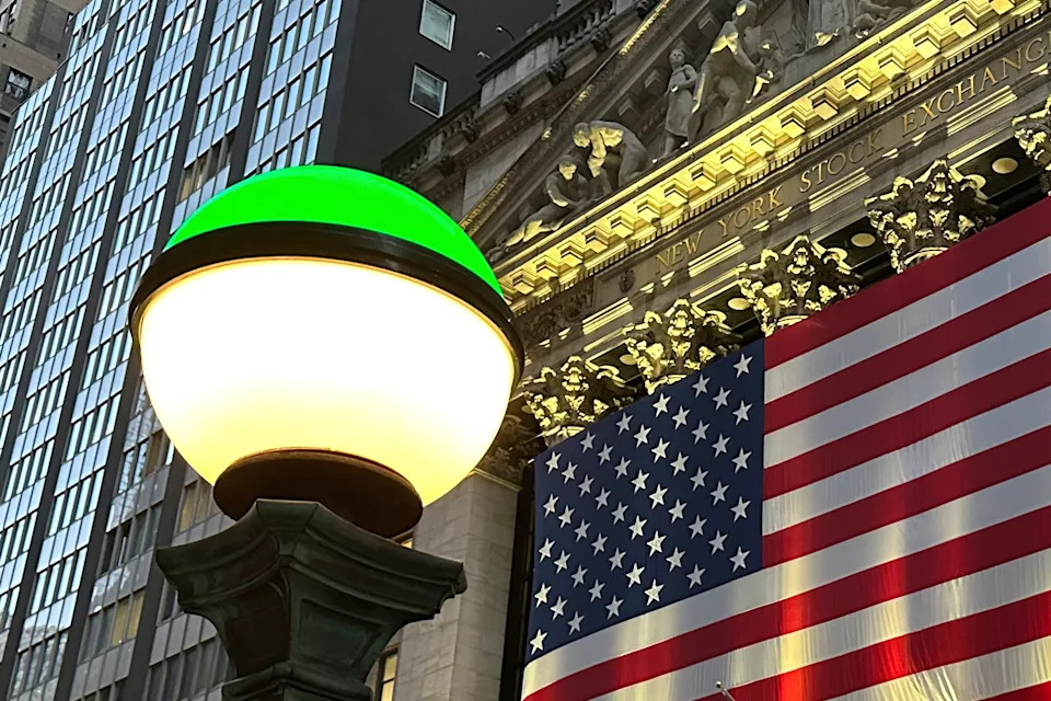 Financial Markets Wall Street FILE - The American flags hangs on the facade of the New York Stock Exchange in New York's Financial District on Tuesday, Nov. 5, 2024. (AP Photo/Peter Morgan, File)
