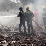 Firefighters work at the site where Air India flight 171 crashed in a residential area near the airport in Ahmedabad on June 12. (Sam Panthaky/AFP via Getty Images)