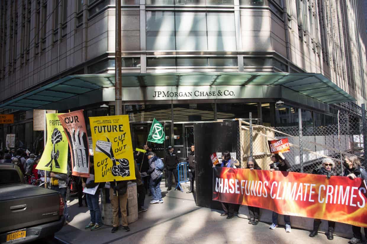 Climate activists demonstrate outside the headquarters of JP Morgan Chase in New York in 2023.
